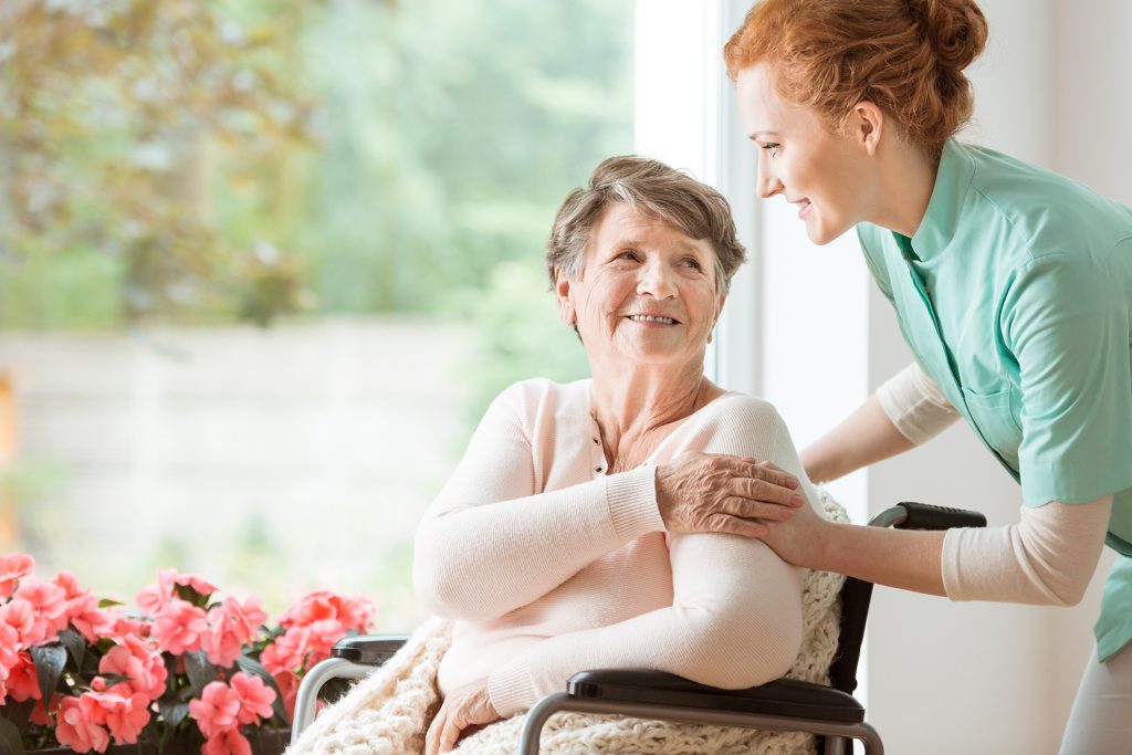 Senior Advisor helping female patient