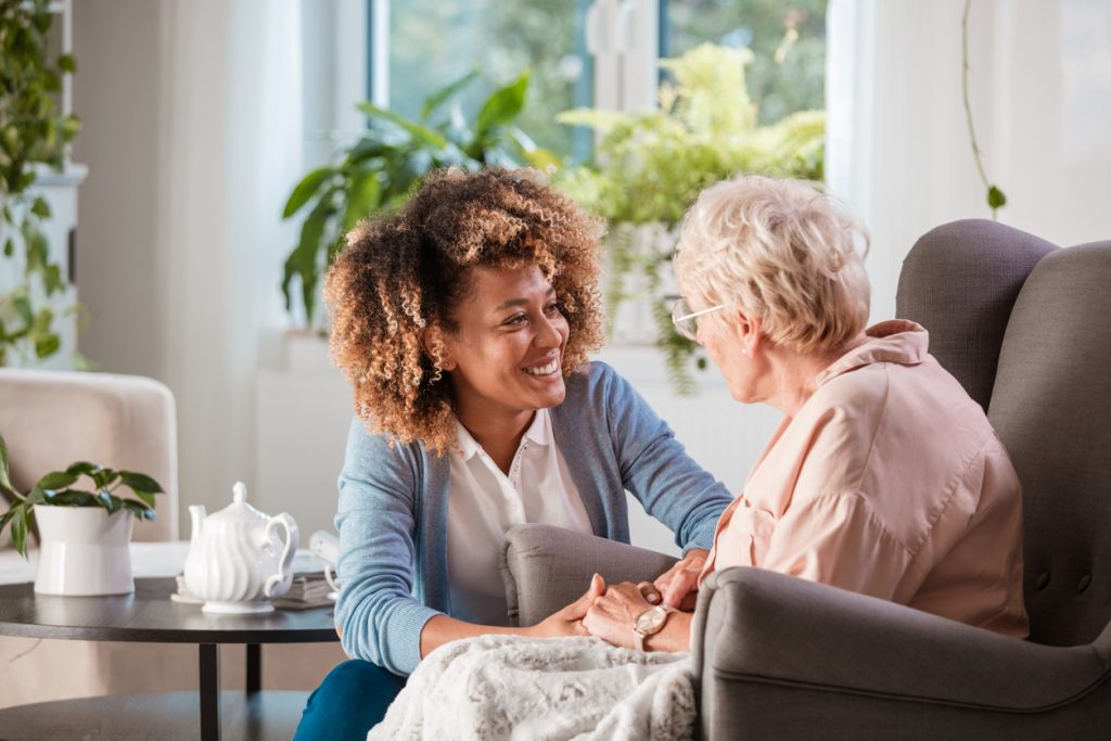 Nurse Talking With An Elderly Woman